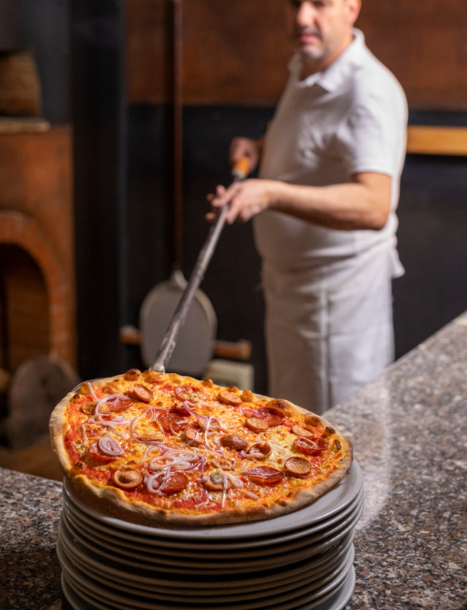 side-view-chef-preparing-pizza